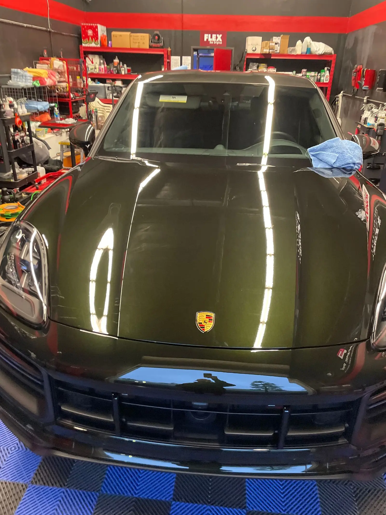 Dark green Porsche with a coated high-gloss finish in the shop