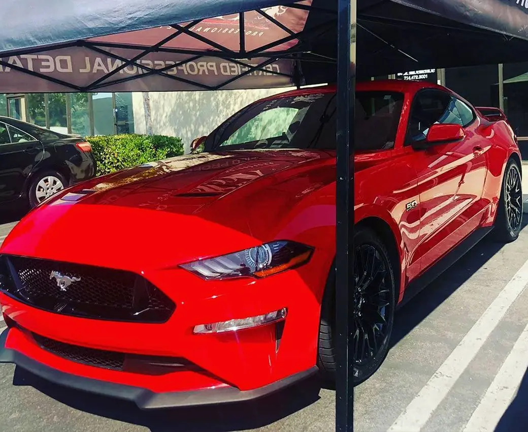 Red Ford Mustang GT detailed under the STRATA canopy