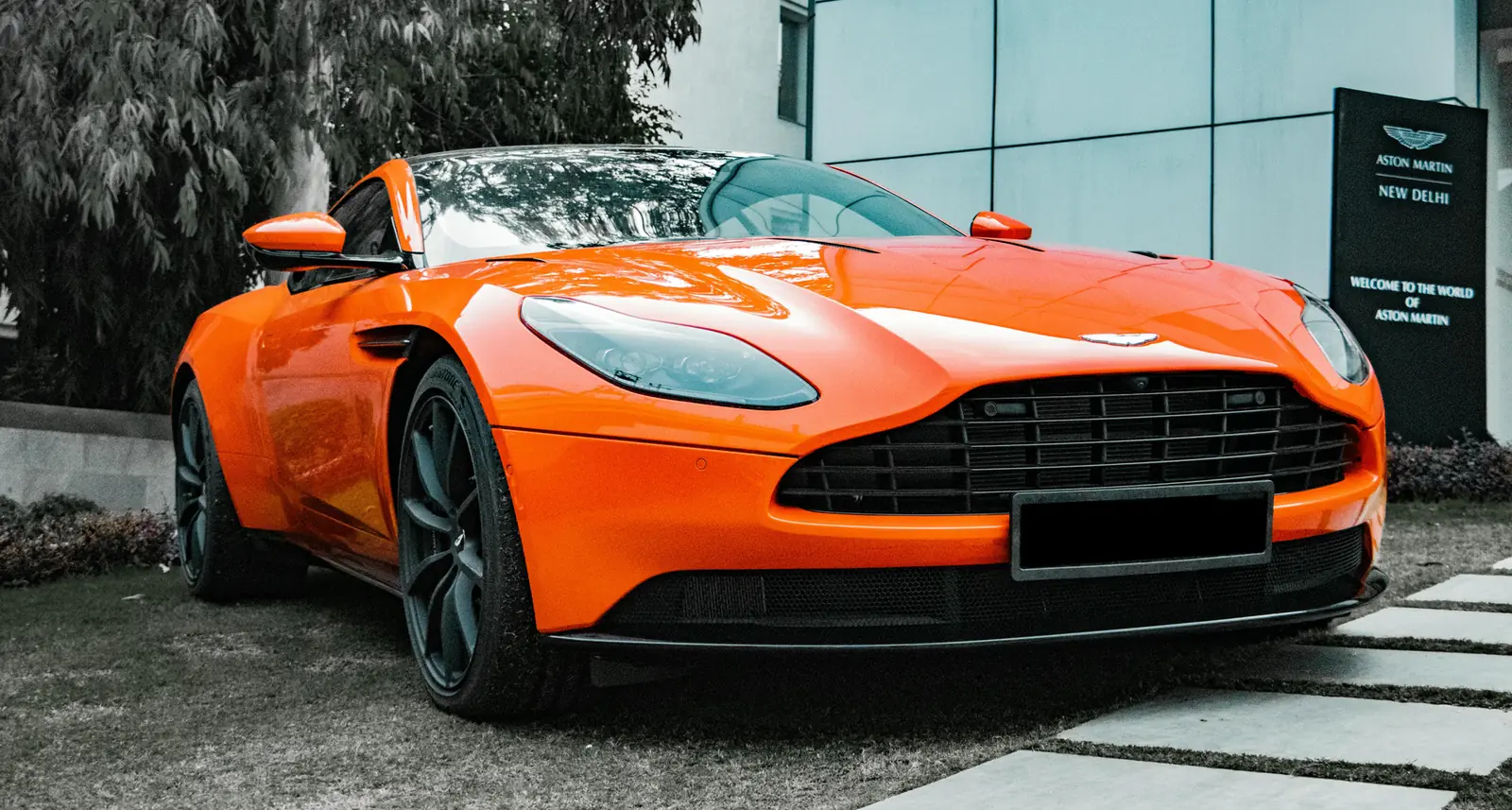 Orange Aston Martin DB11 with a flawless gloss finish
